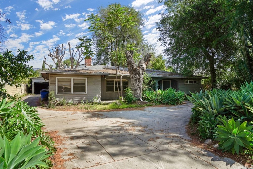 415 Alster Avenue Arcadia, CA 91006 - Photo 2 of 16 a front view of a house with a yard and potted plants