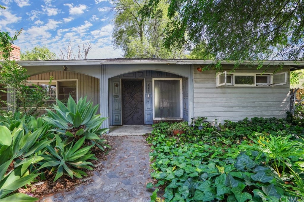 415 Alster Avenue Arcadia, CA 91006 - Photo 3 of 16 a front view of a house with a garden