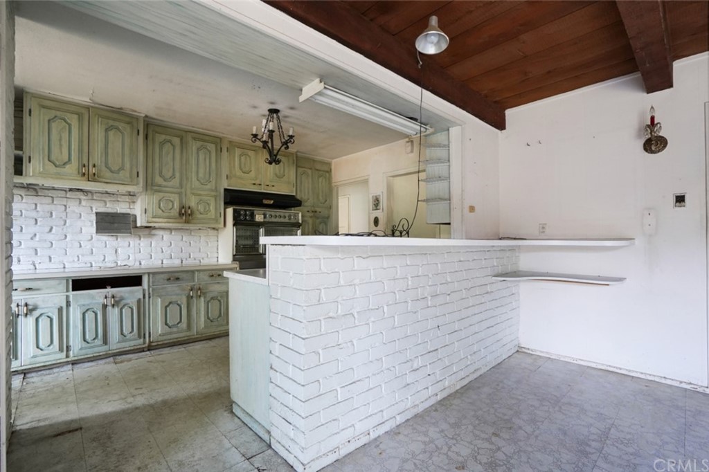 415 Alster Avenue Arcadia, CA 91006 - Photo 7 of 16 a kitchen with stainless steel appliances granite countertop a stove and cabinets