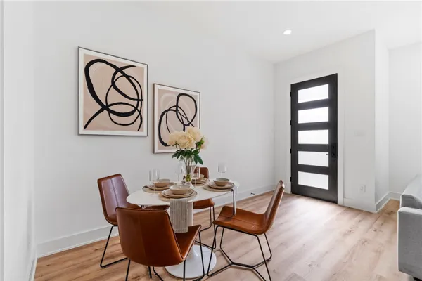 a view of a dining room with furniture and window