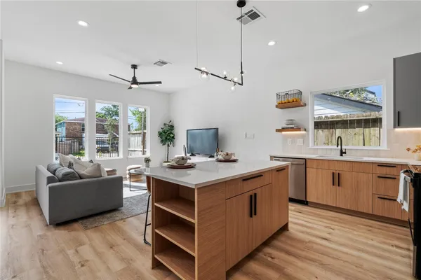 a kitchen with a stove and a sink