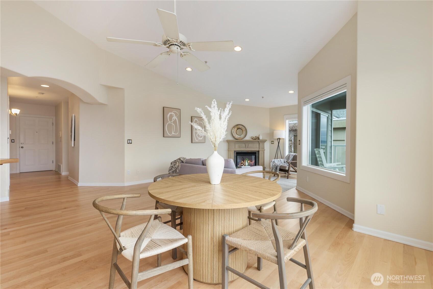 550 Dayton Street, Unit 201 Edmonds, WA 98020 - Photo 11 of 38 a living room with a dining table and a fireplace