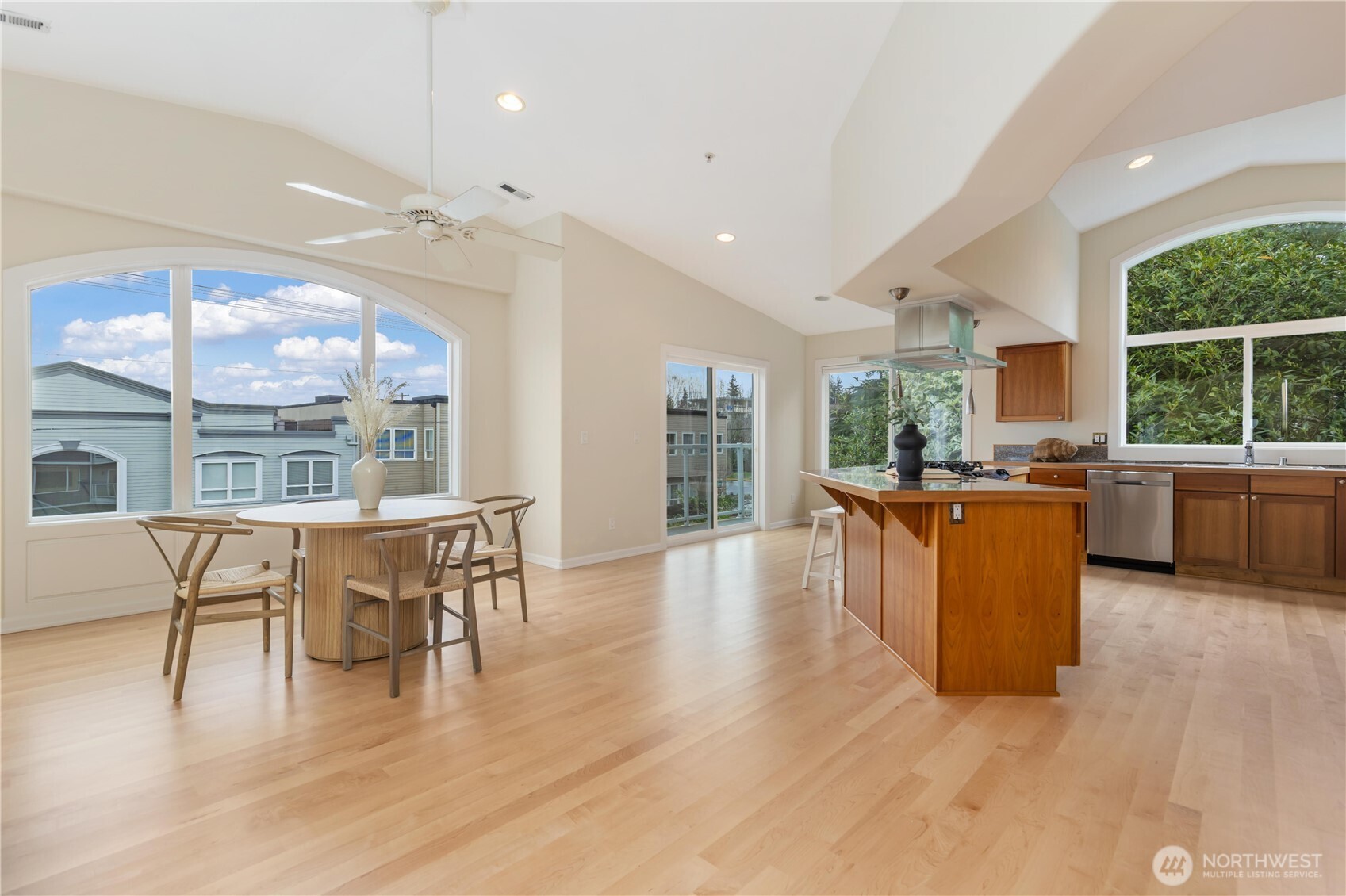 550 Dayton Street, Unit 201 Edmonds, WA 98020 - Photo 13 of 38 a living room with furniture a wooden floor and a large window