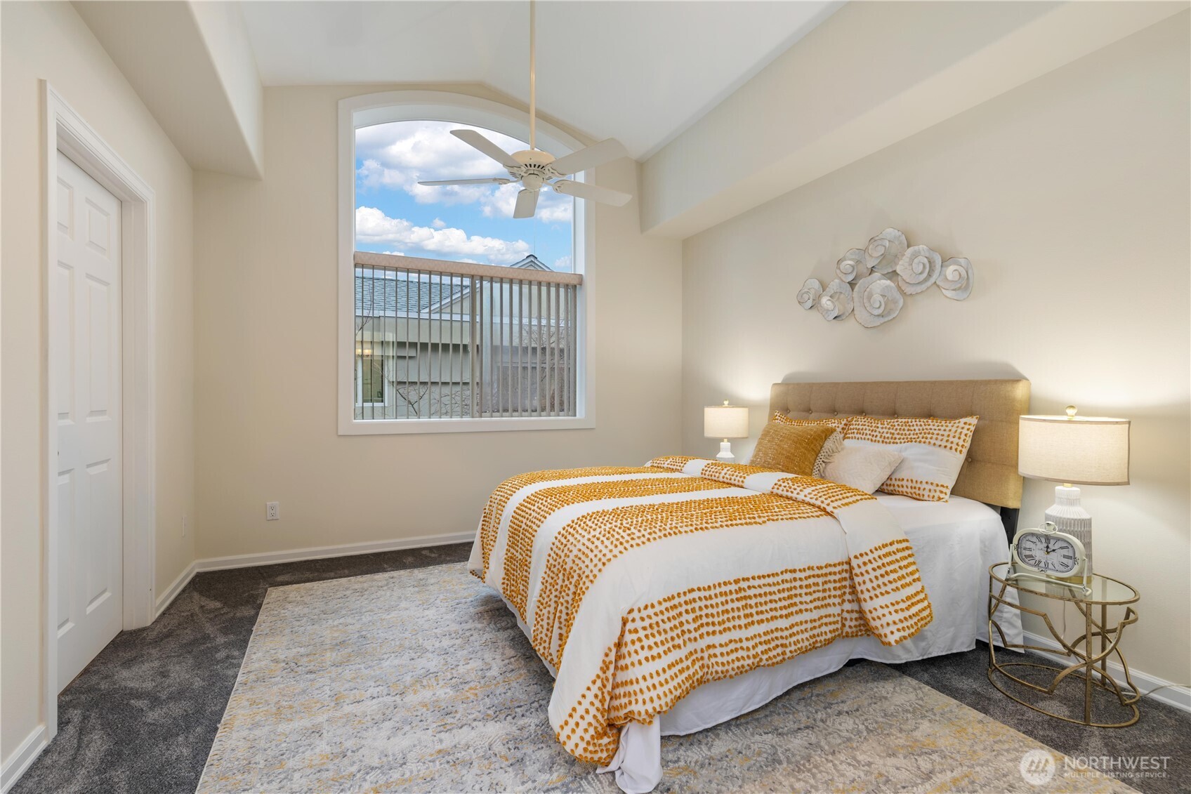 550 Dayton Street, Unit 201 Edmonds, WA 98020 - Photo 20 of 38 a bedroom with a bed and a painting on the wall