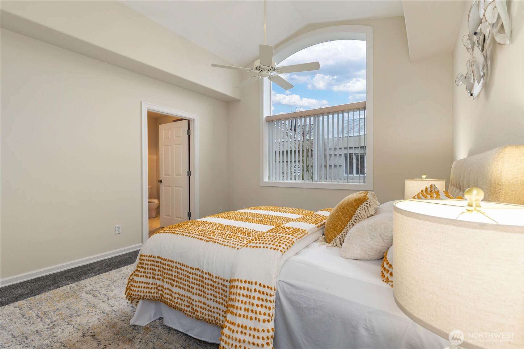 550 Dayton Street, Unit 201 Edmonds, WA 98020 - Photo 21 of 38 a bedroom with a bed and a window