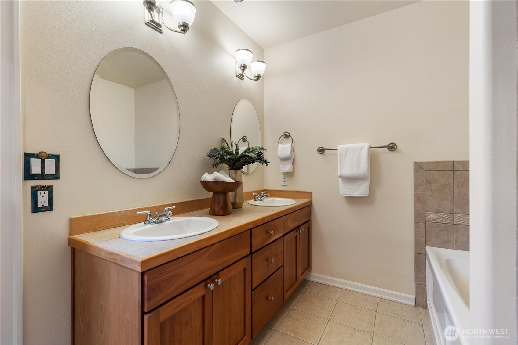 550 Dayton Street, Unit 201 Edmonds, WA 98020 - Photo 24 of 38 a bathroom with a sink and a mirror