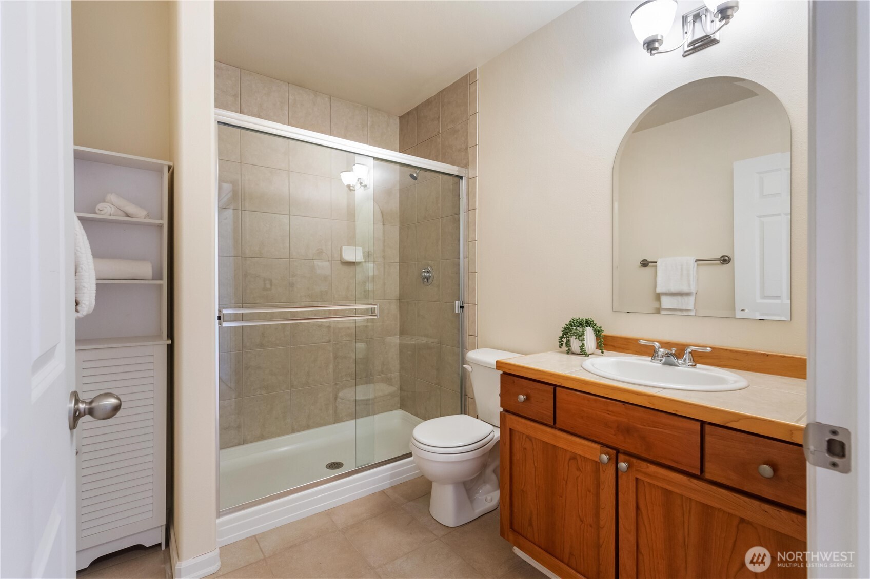 550 Dayton Street, Unit 201 Edmonds, WA 98020 - Photo 28 of 38 a bathroom with a sink a toilet and shower