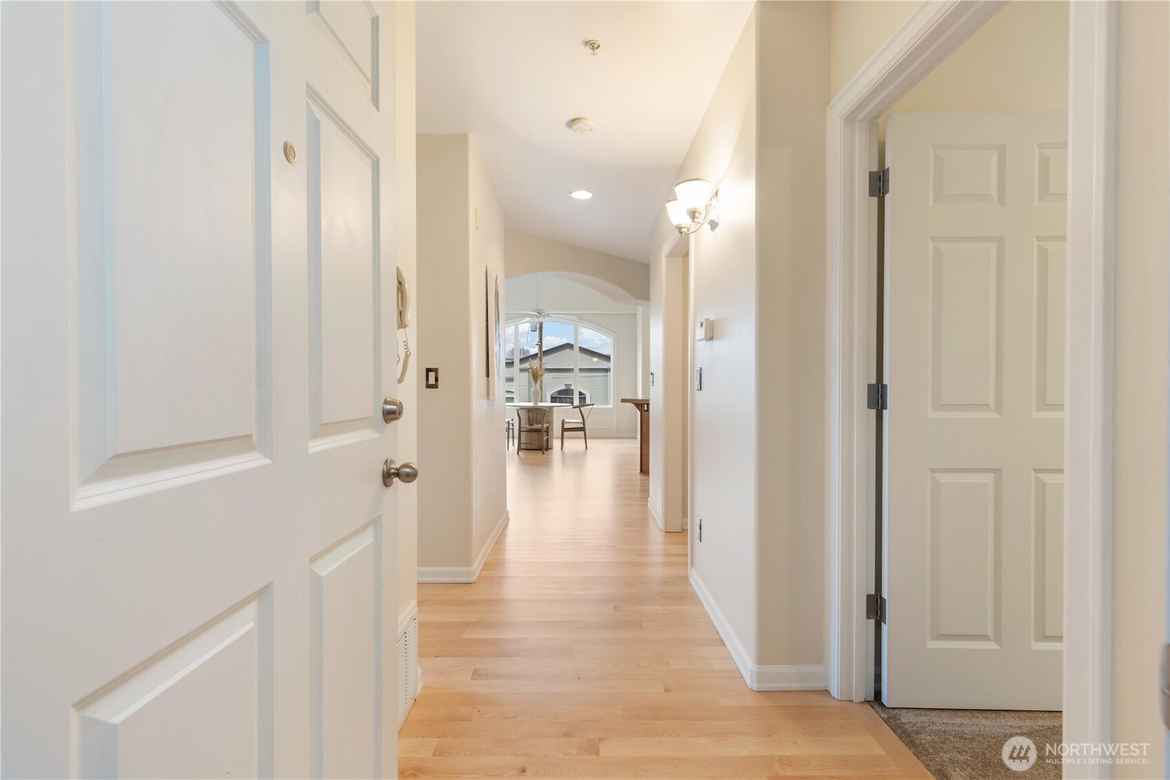 550 Dayton Street, Unit 201 Edmonds, WA 98020 - Photo 3 of 38 a view of a hallway with wooden floor windows and a bathroom