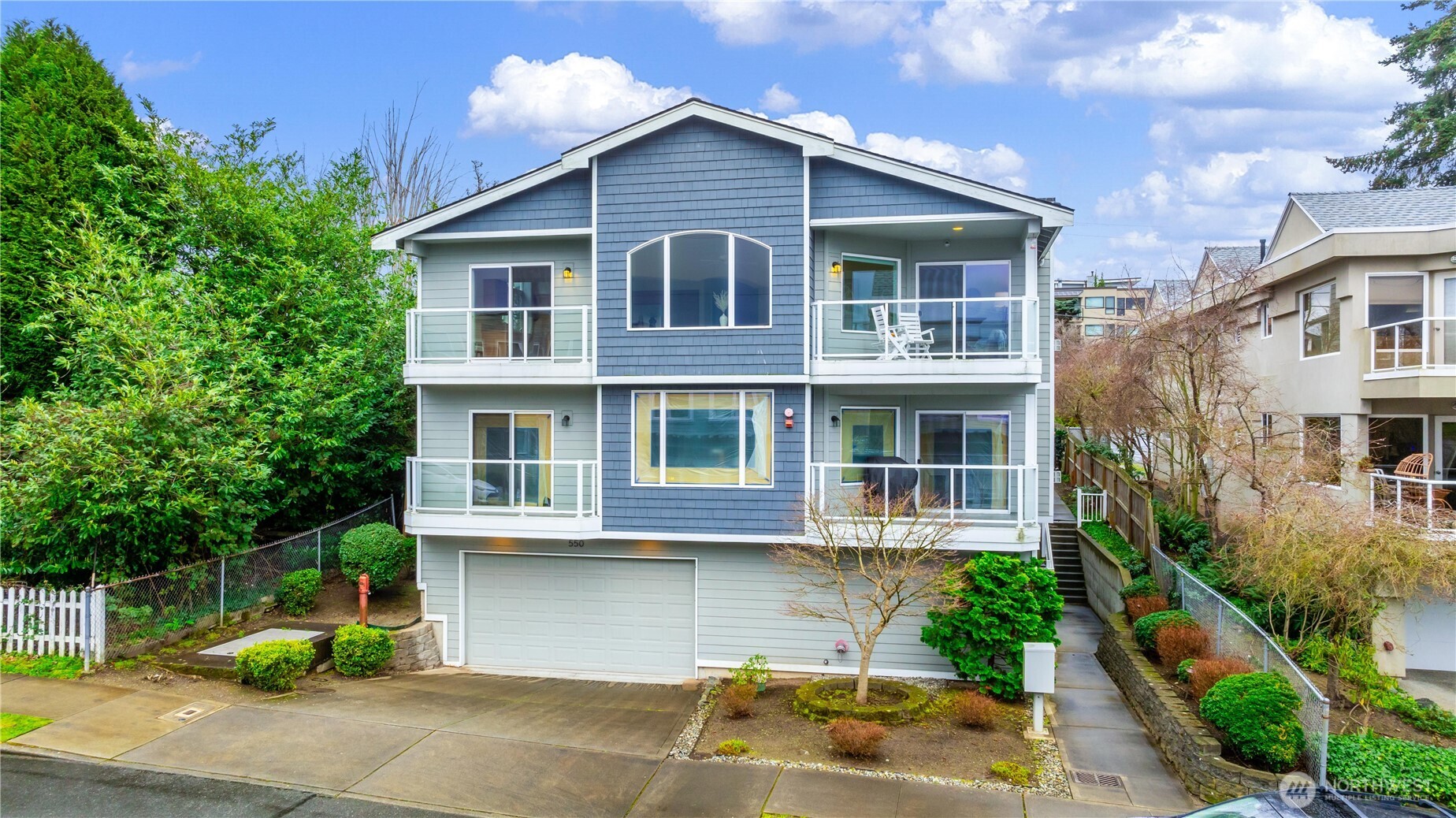 550 Dayton Street, Unit 201 Edmonds, WA 98020 - Photo 38 of 38 a front view of a house with a yard
