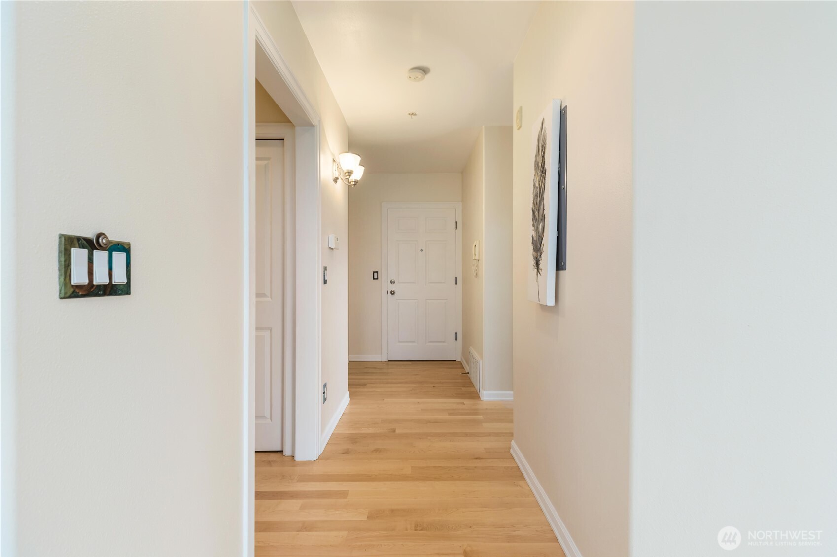 550 Dayton Street, Unit 201 Edmonds, WA 98020 - Photo 4 of 38 a view of a hallway with wooden floor