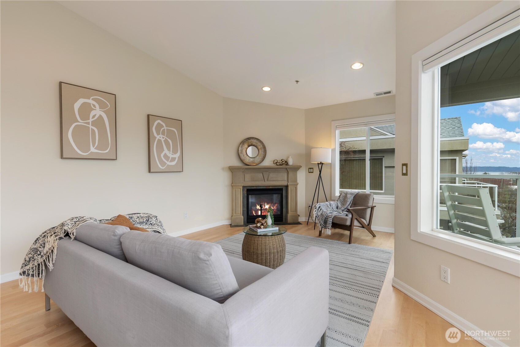 550 Dayton Street, Unit 201 Edmonds, WA 98020 - Photo 8 of 38 a living room with furniture and a fireplace