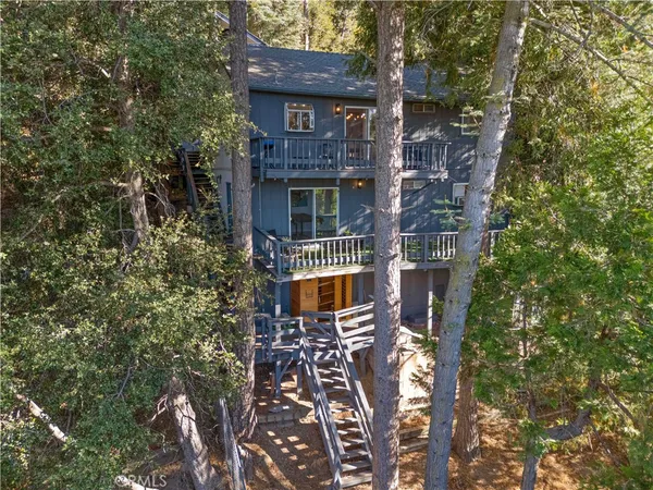 front view of a house with a tree