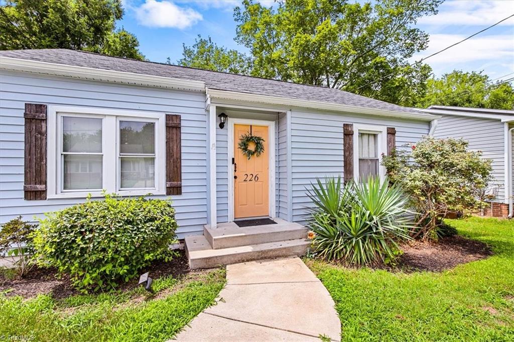 226 Friendly Avenue High Point, NC 27260 - Photo 3 of 38 A bright yellow front door welcomes buyers to 226 Friendly Avenue, a High Point bungalow with real income potential and full seller transparency.