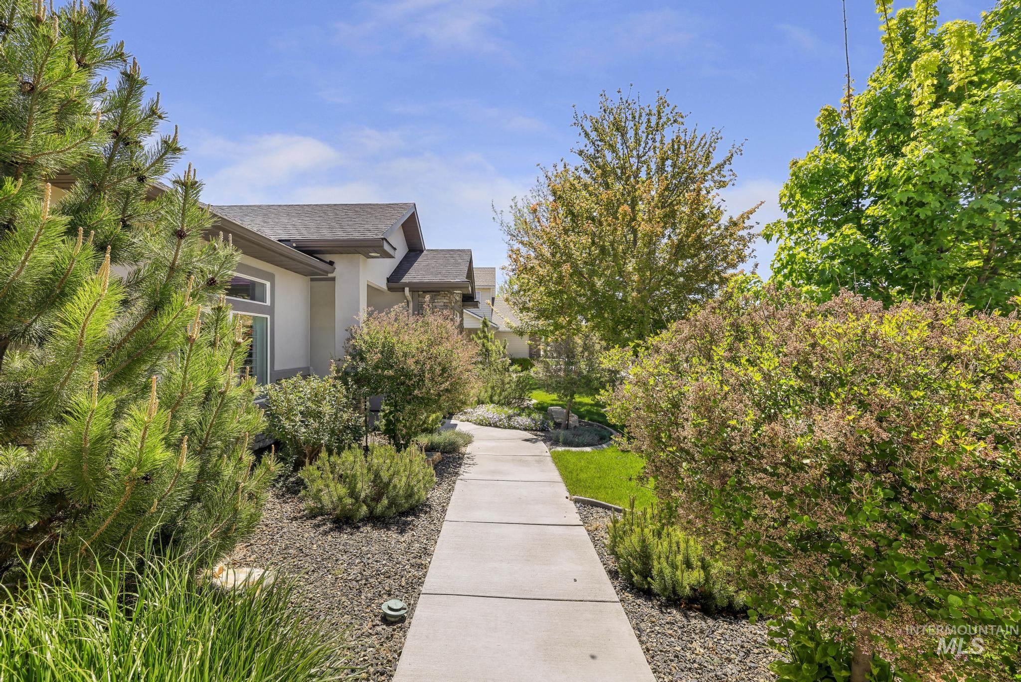1937 Tamarack Loop Twin Falls, ID 83301 - Photo 5 of 50 Concrete pathway flanked by diverse landscaping