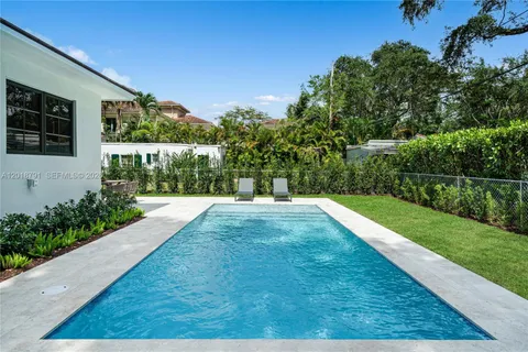 a view of swimming pool with a yard