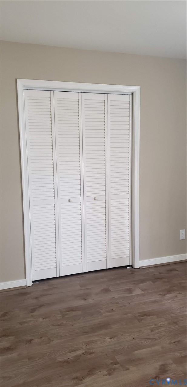 7166 Full Rack Drive Midlothian, VA 23112 - Photo 15 of 19 a view of an empty room with wooden floor