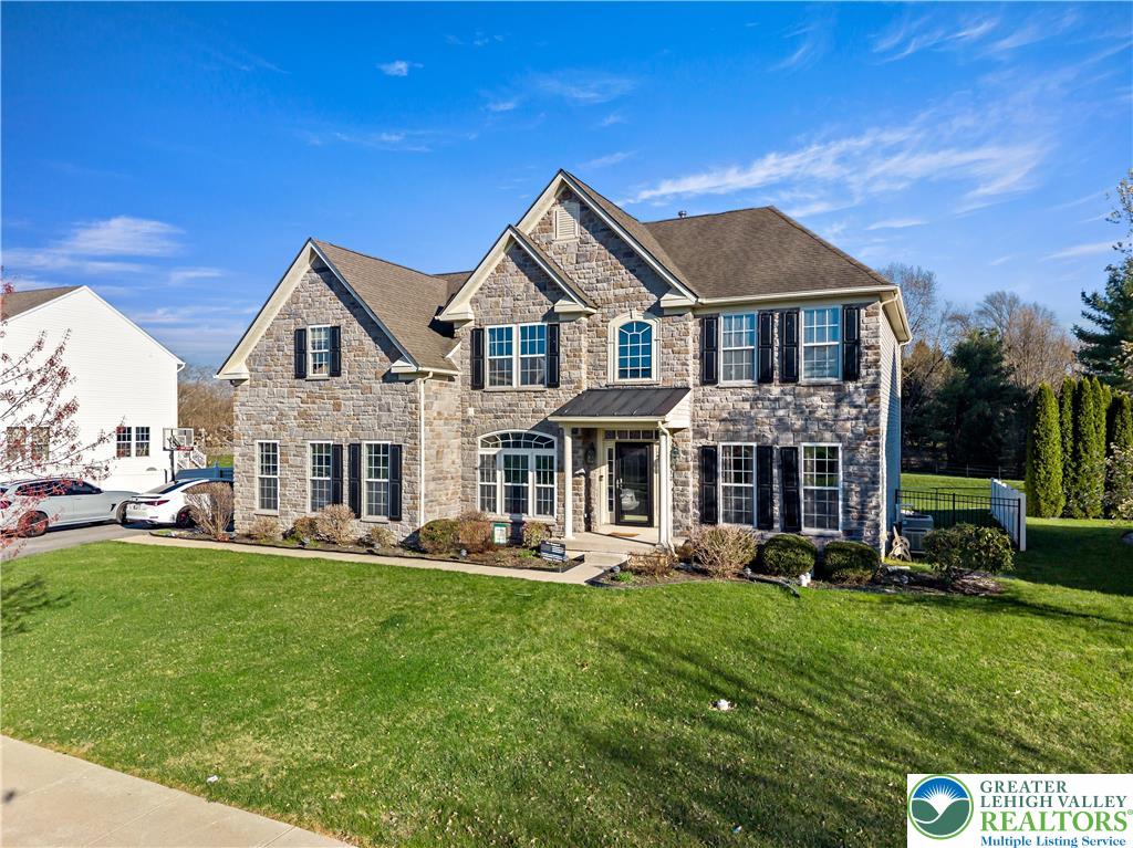 130 Lower Way Road Easton, PA 18045 - Photo 5 of 56 a front view of a house with garden and trees