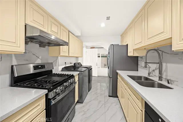 a bedroom with a bed a chair and piano