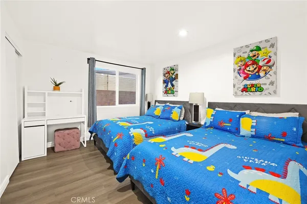 a bedroom with a bed and a dresser