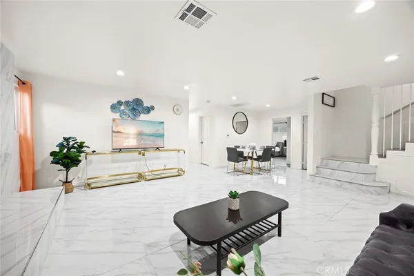 a living room with furniture and a table