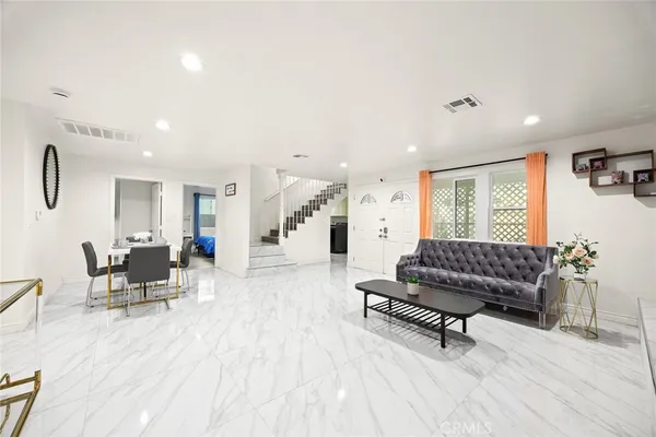 a living room with furniture and a couch