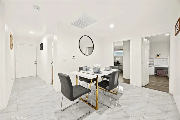 a view of a livingroom with furniture and white walls