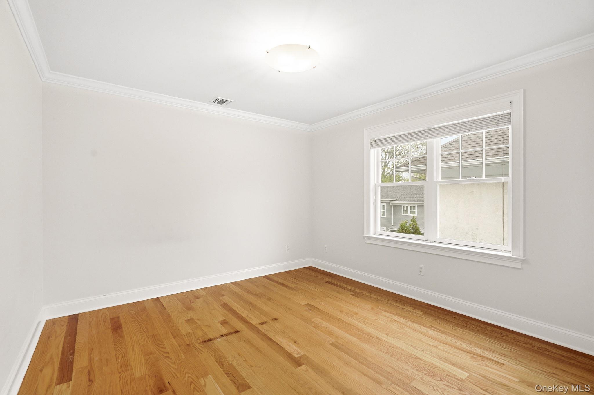 228 Central Avenue Rye, NY 10580 - Photo 18 of 24 an empty room with a window