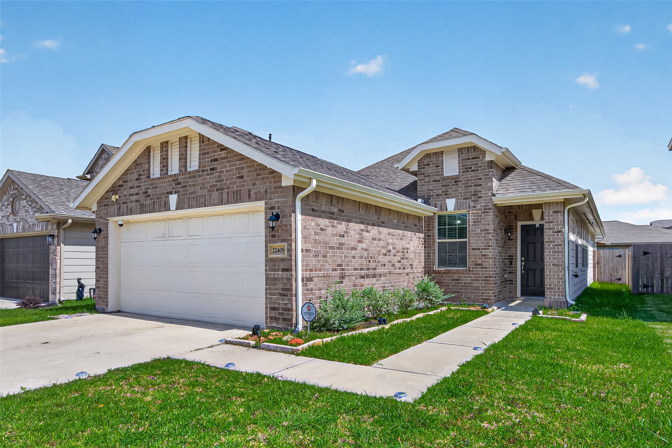 22409 Kinley Street New Caney, TX 77357 - Photo 1 of 46 a front view of a house with a yard