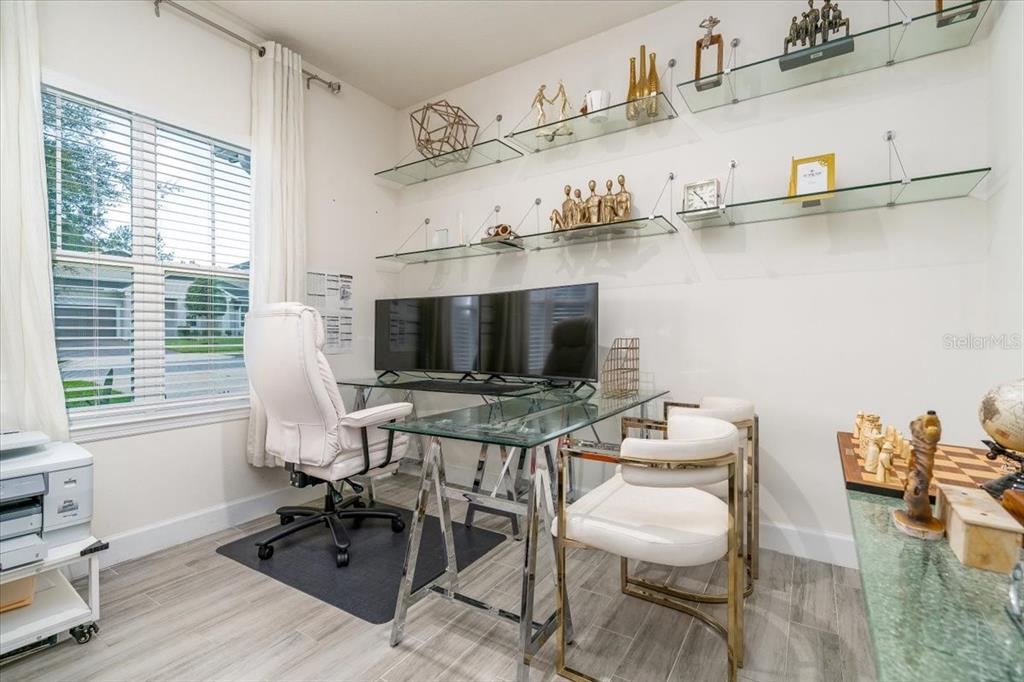 1296 Waterview Ridge Circle Apopka, FL 32703 - Photo 16 of 60 a view of a workspace with furniture and a window