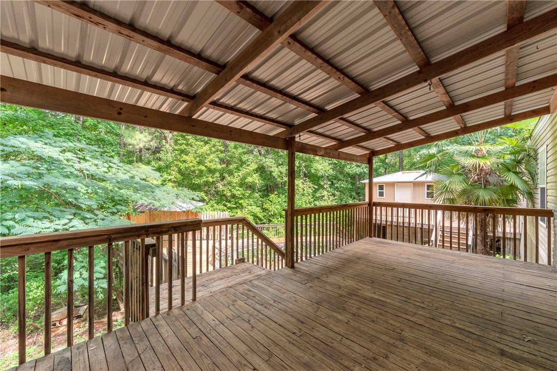 383 Rocky Knoll Road Walhalla, SC 29691 - Photo 42 of 50 A spacious covered deck offers views of the surroundings, perfect for outdoor relaxation.