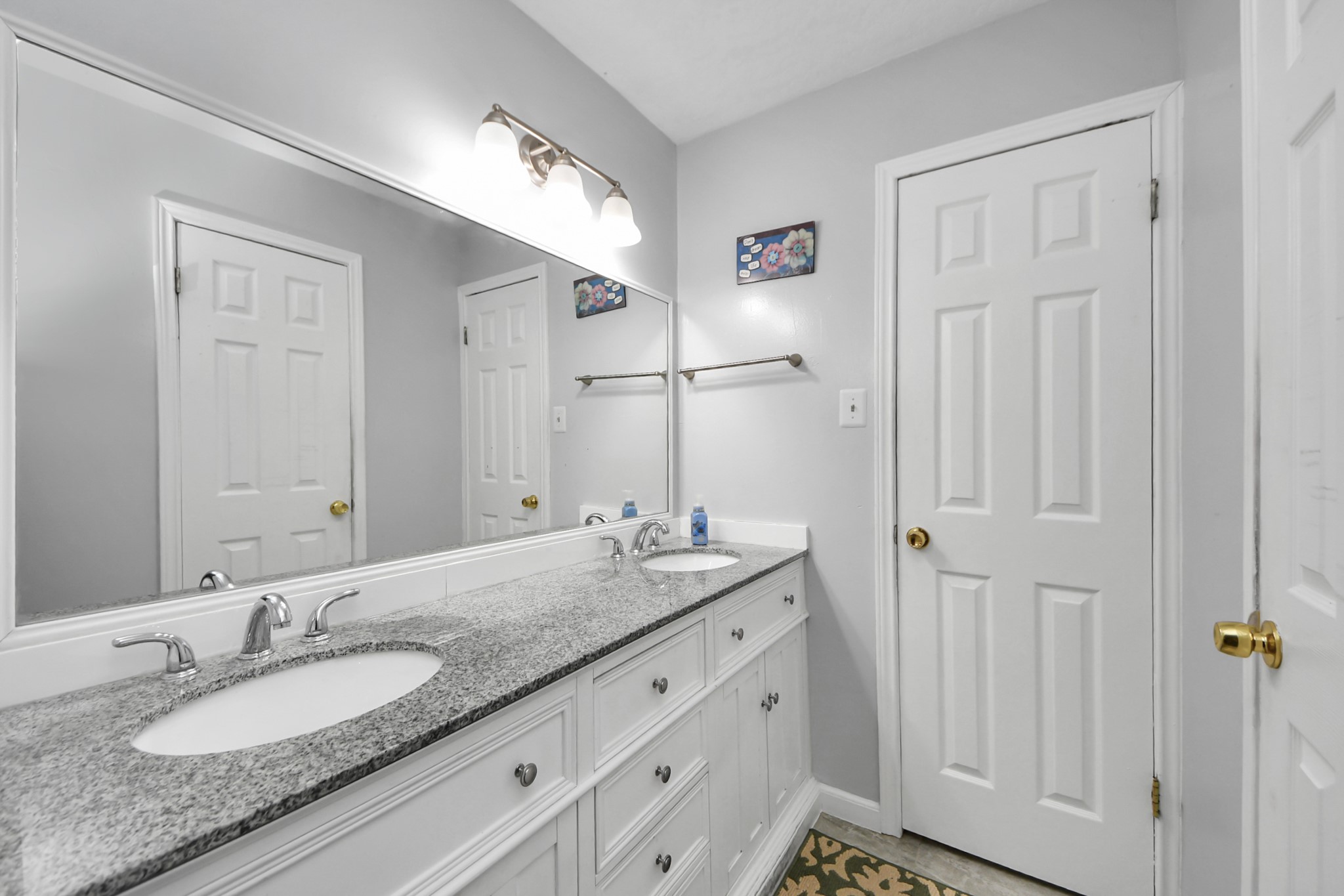 4155 Amir Street Houston, TX 77072 - Photo 38 of 43 a bathroom with 2 sink and a mirror