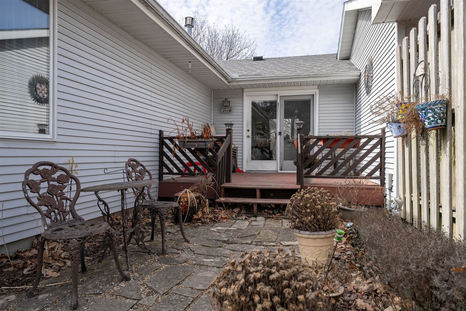 106 North Blair Drive, Unit 2 Normal, IL 61761 - Photo 19 of 22 a view of a patio with table and chairs and potted plants