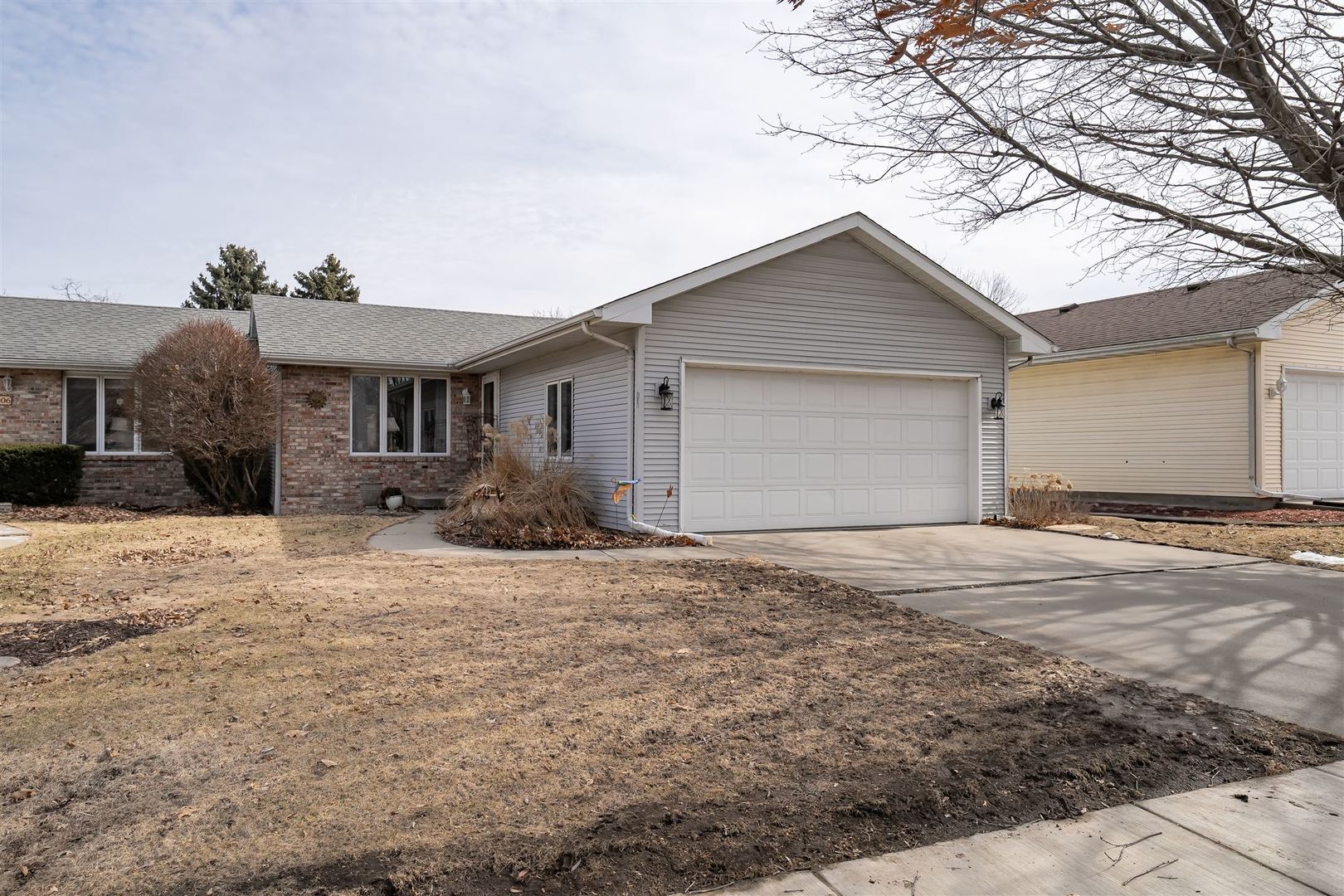 106 North Blair Drive, Unit 2 Normal, IL 61761 - Photo 2 of 22 a front view of a house with a yard and garage