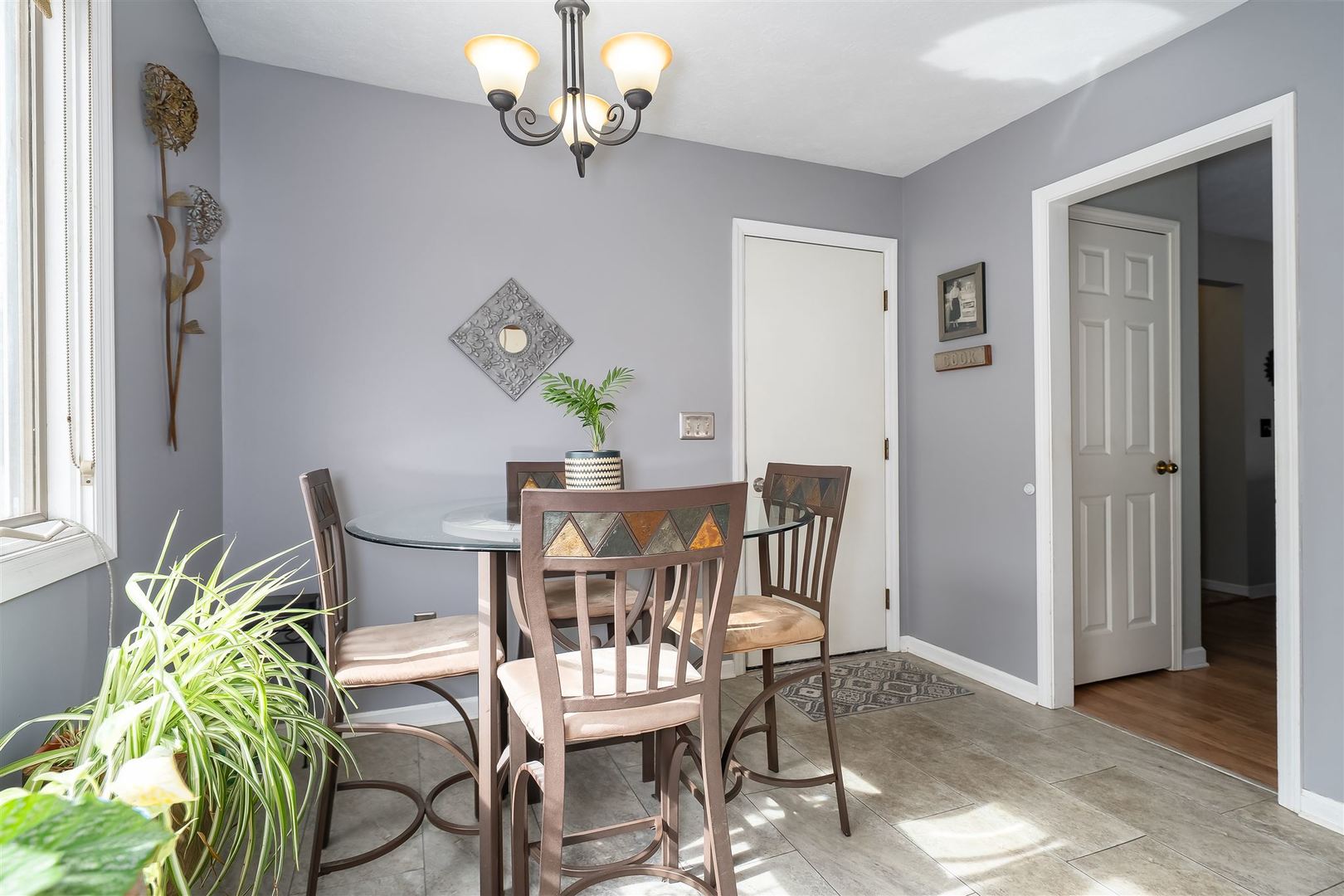 106 North Blair Drive, Unit 2 Normal, IL 61761 - Photo 6 of 22 a view of a dining room with furniture and chandelier