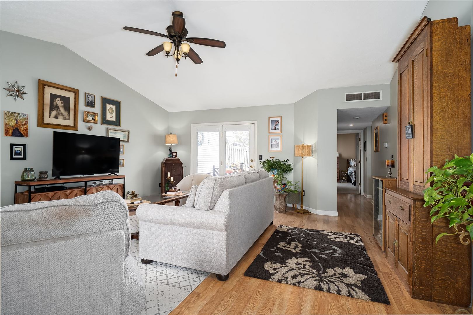106 North Blair Drive, Unit 2 Normal, IL 61761 - Photo 7 of 22 a living room with furniture and a flat screen tv