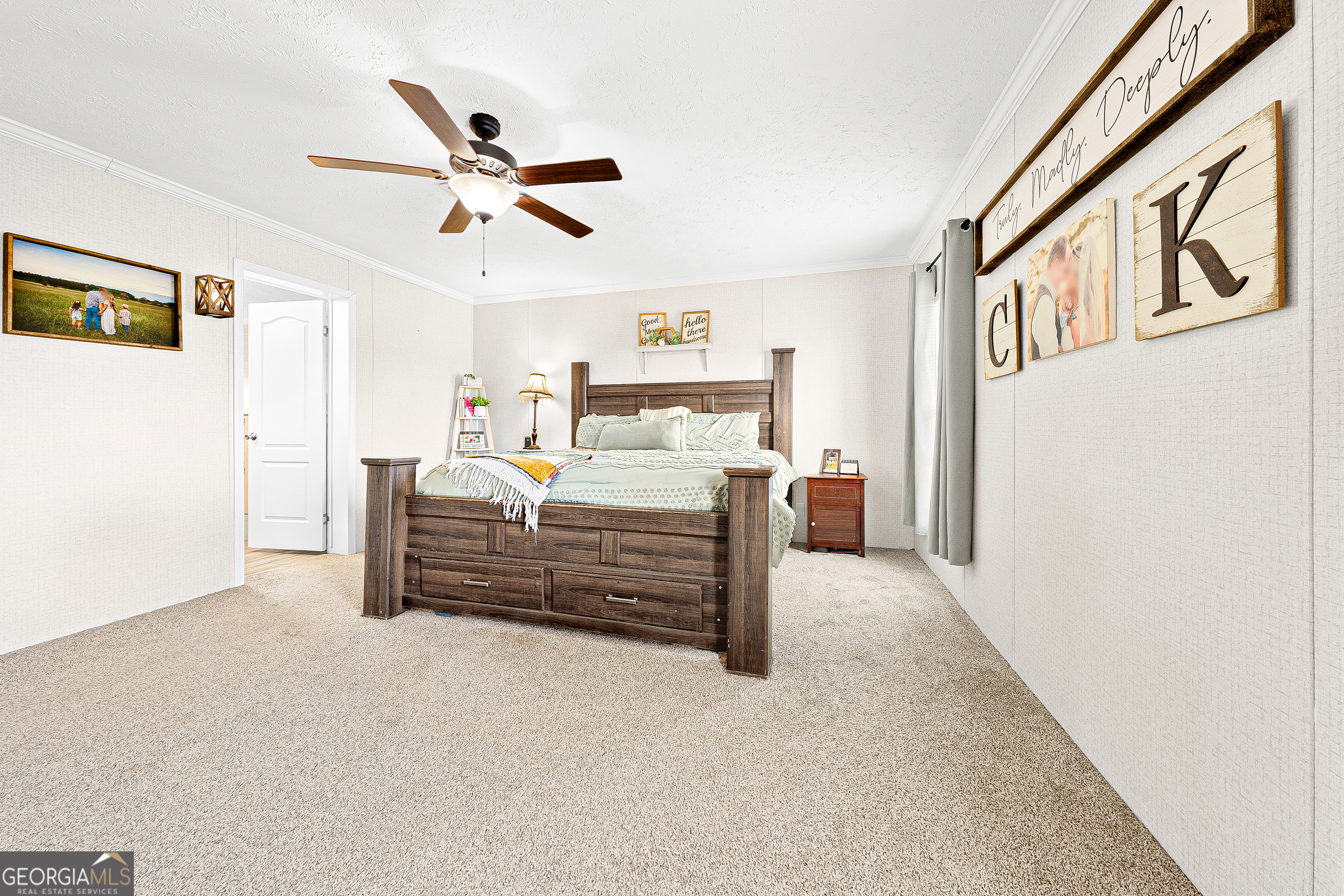 655 Lowe Road Comer, GA 30629 - Photo 11 of 19 a bed room with furniture and a ceiling fan