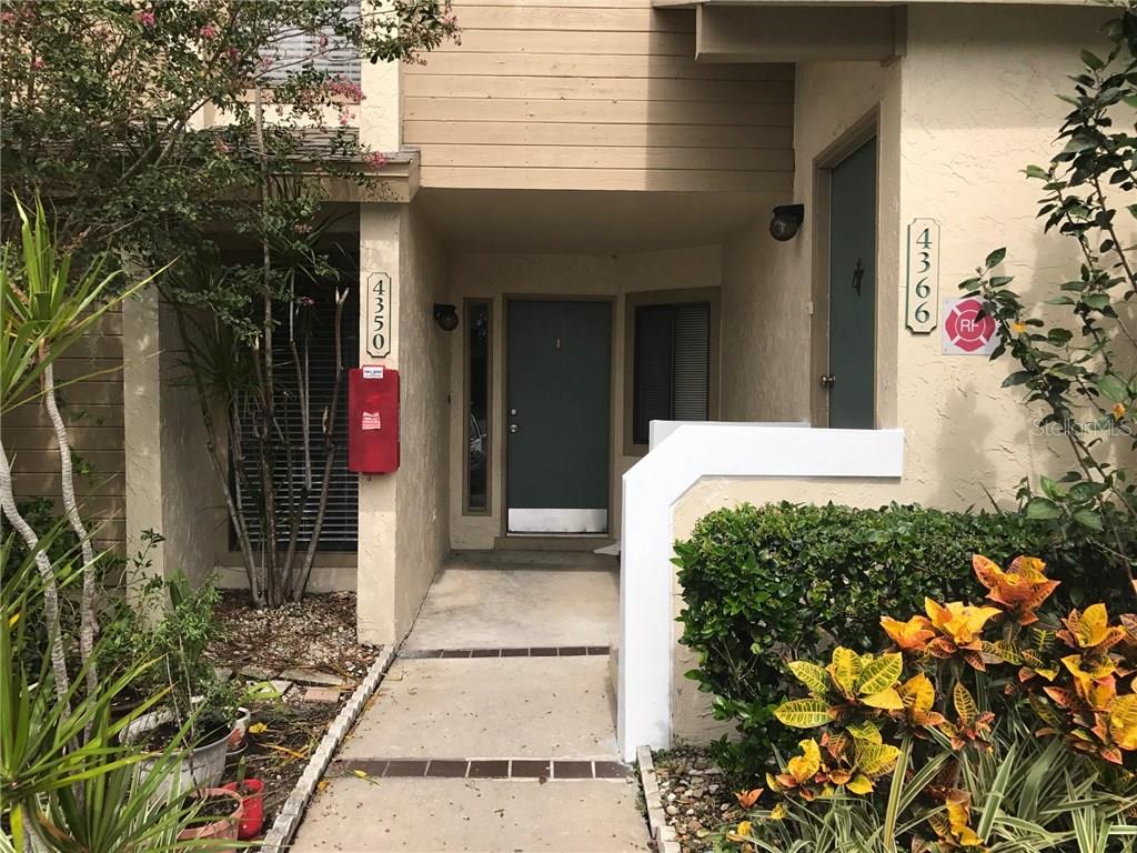 4350 Middlebrook Road, Unit 3 Orlando, FL 32811 - Photo 1 of 1 a front view of a house with a porch
