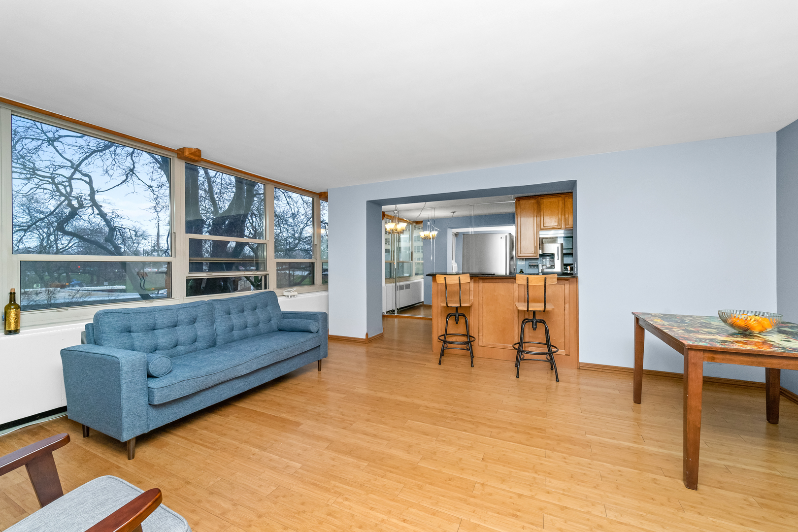 3950 North Lake Shore Drive, Unit 228 Chicago, IL 60613 - Photo 11 of 28 a living room with furniture and a large window