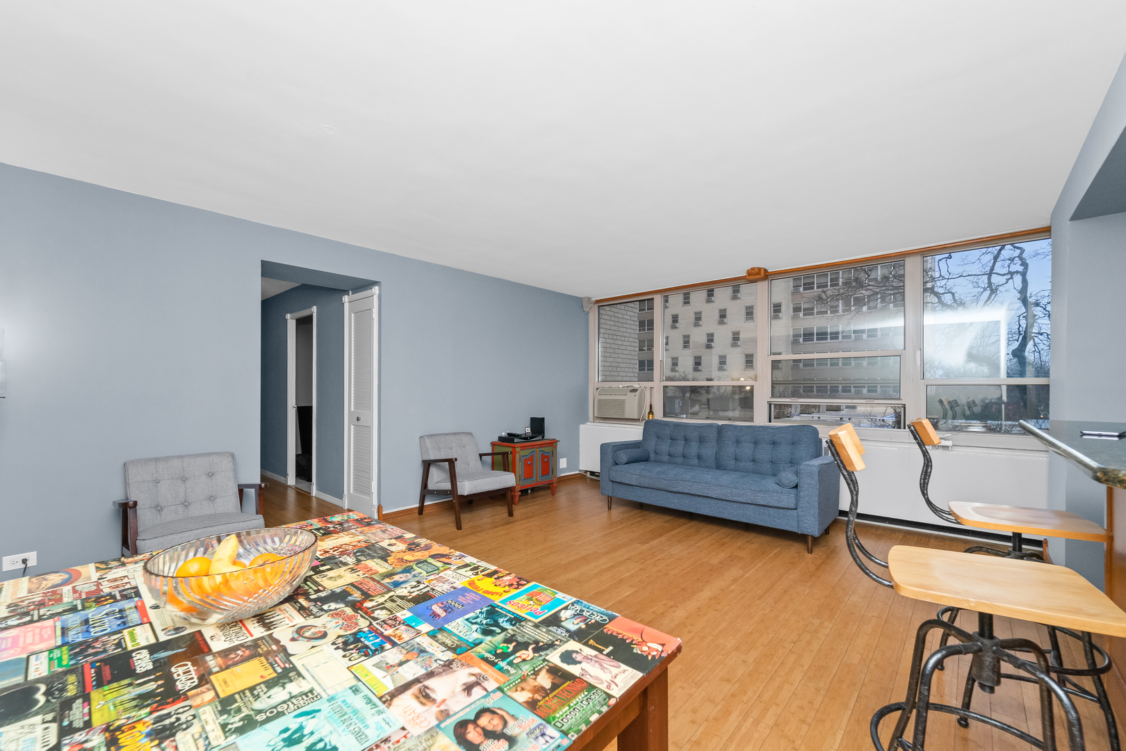 3950 North Lake Shore Drive, Unit 228 Chicago, IL 60613 - Photo 12 of 28 a bedroom with a bed and a dresser in it