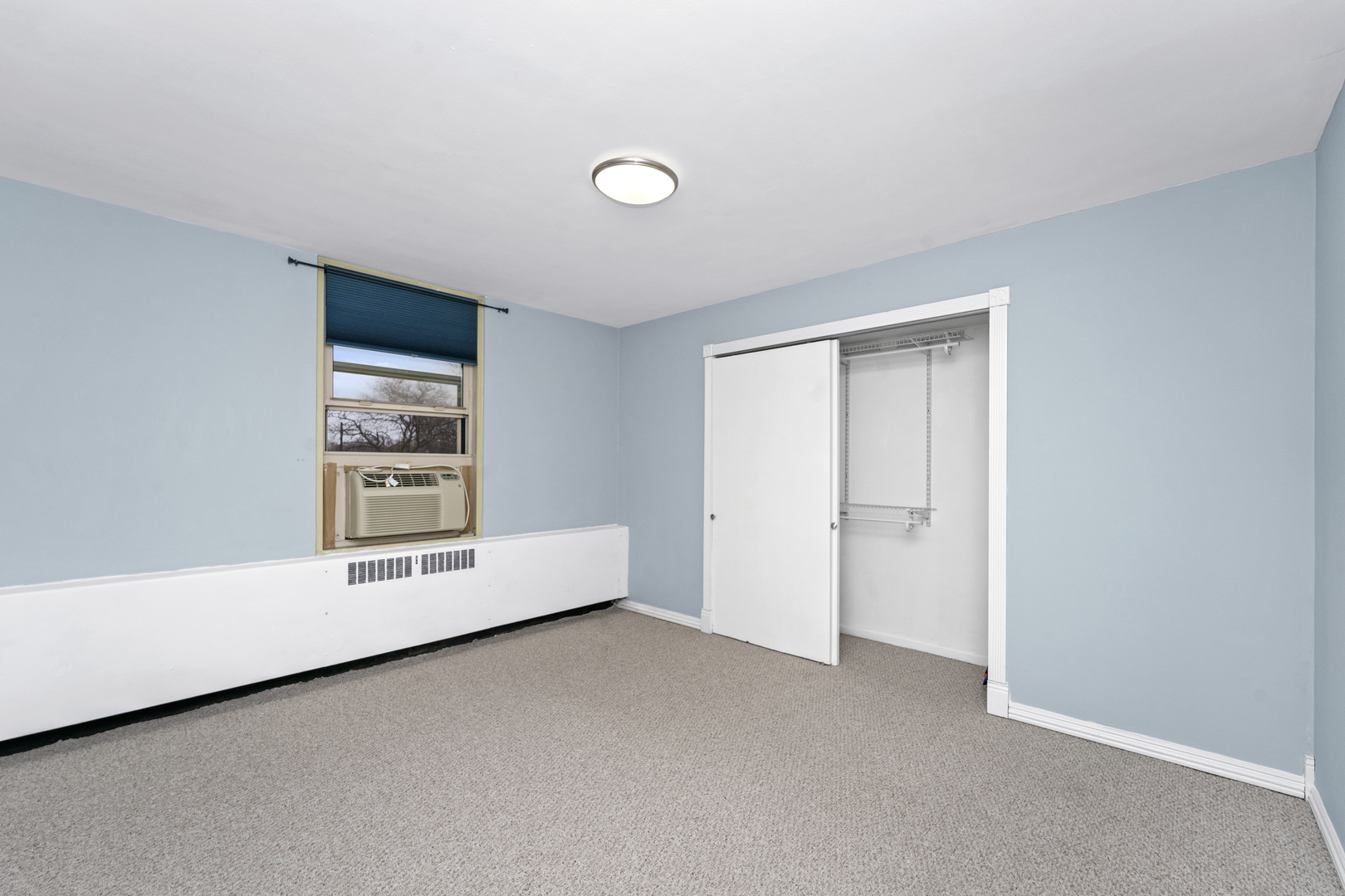 3950 North Lake Shore Drive, Unit 228 Chicago, IL 60613 - Photo 15 of 28 a view of an empty room with a window