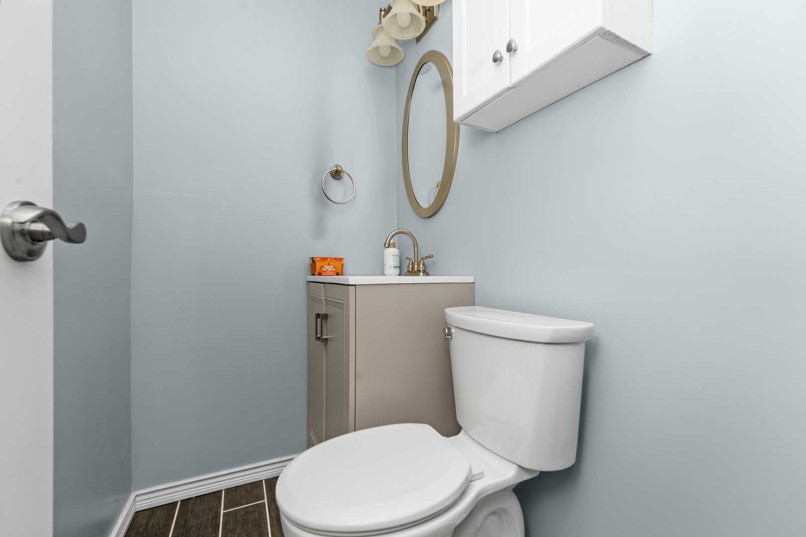 3950 North Lake Shore Drive, Unit 228 Chicago, IL 60613 - Photo 23 of 28 a white toilet sitting next to a bathroom sink