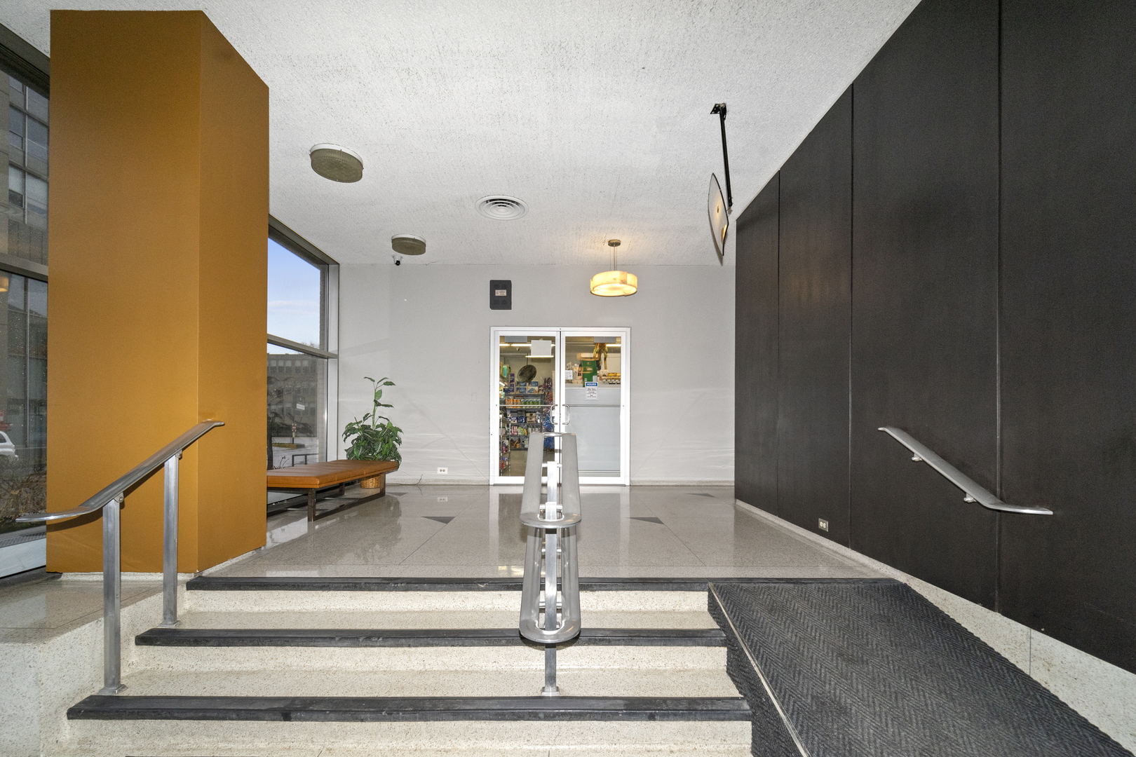 3950 North Lake Shore Drive, Unit 228 Chicago, IL 60613 - Photo 5 of 28 a view of staircase with black carpet
