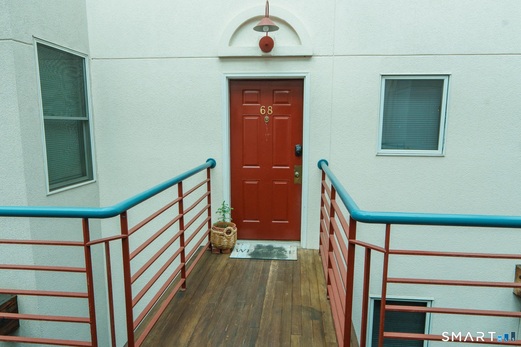 839 Main Street, Unit 68 Torrington, CT 06790 - Photo 14 of 20 a front door view of a house with a porch