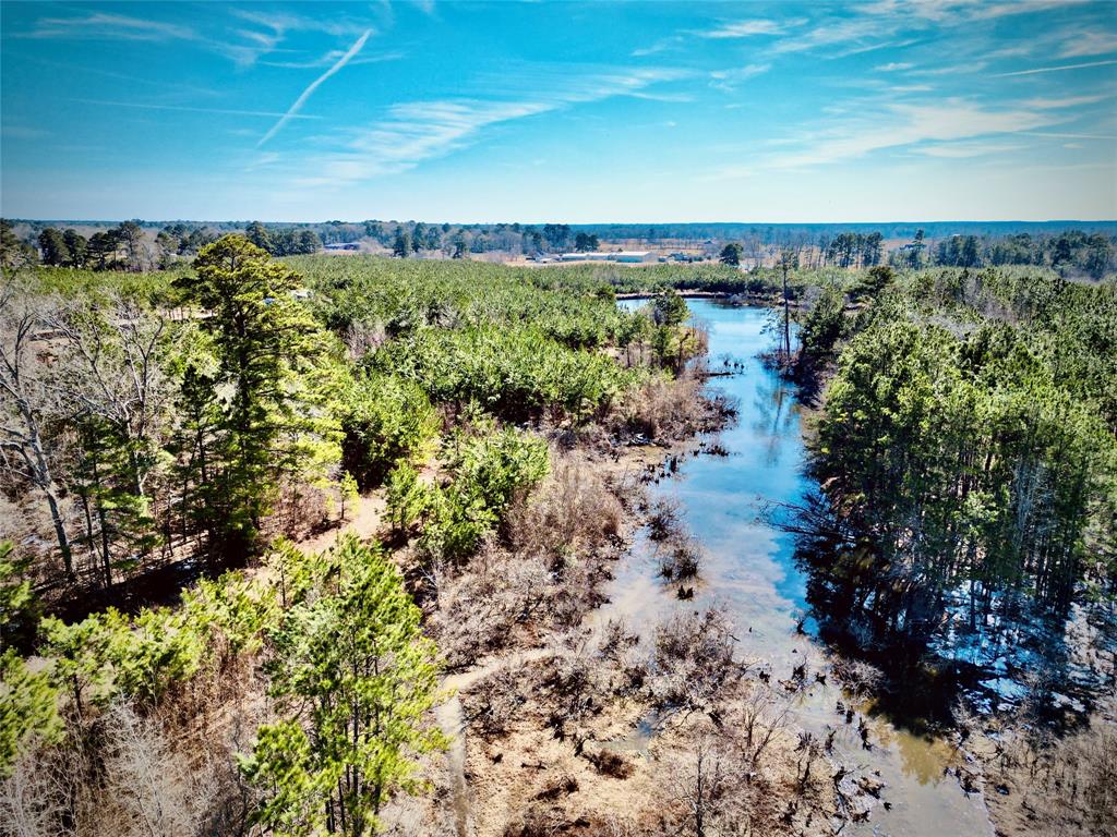0 Stonewall-Frierson Road Frierson, LA 71027 - Photo 10 of 22 a view of a lake with a building in back