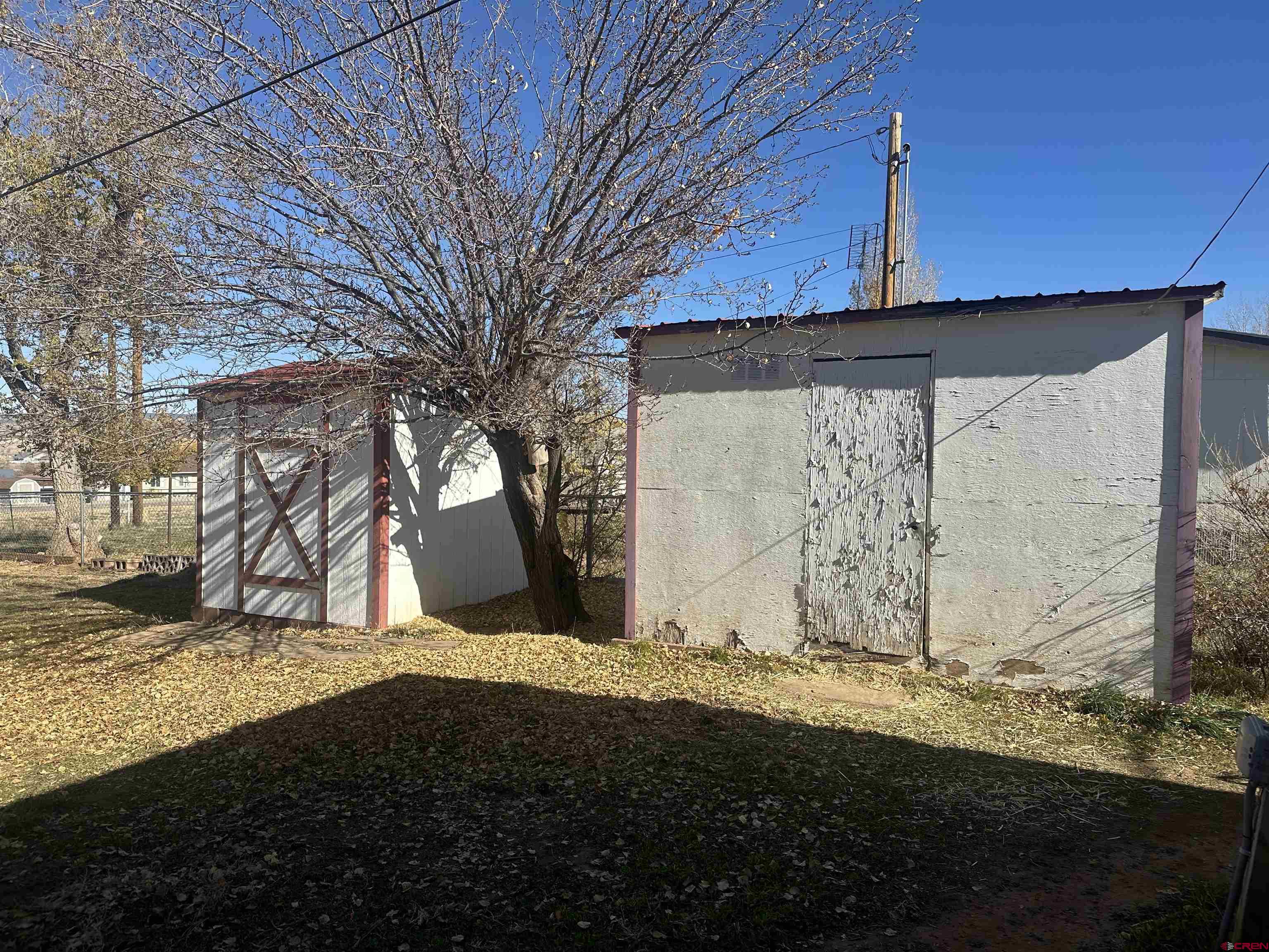 1318 Jackson Street Cortez, CO 81321 - Photo 13 of 13 a view of a house with a snow in the yard