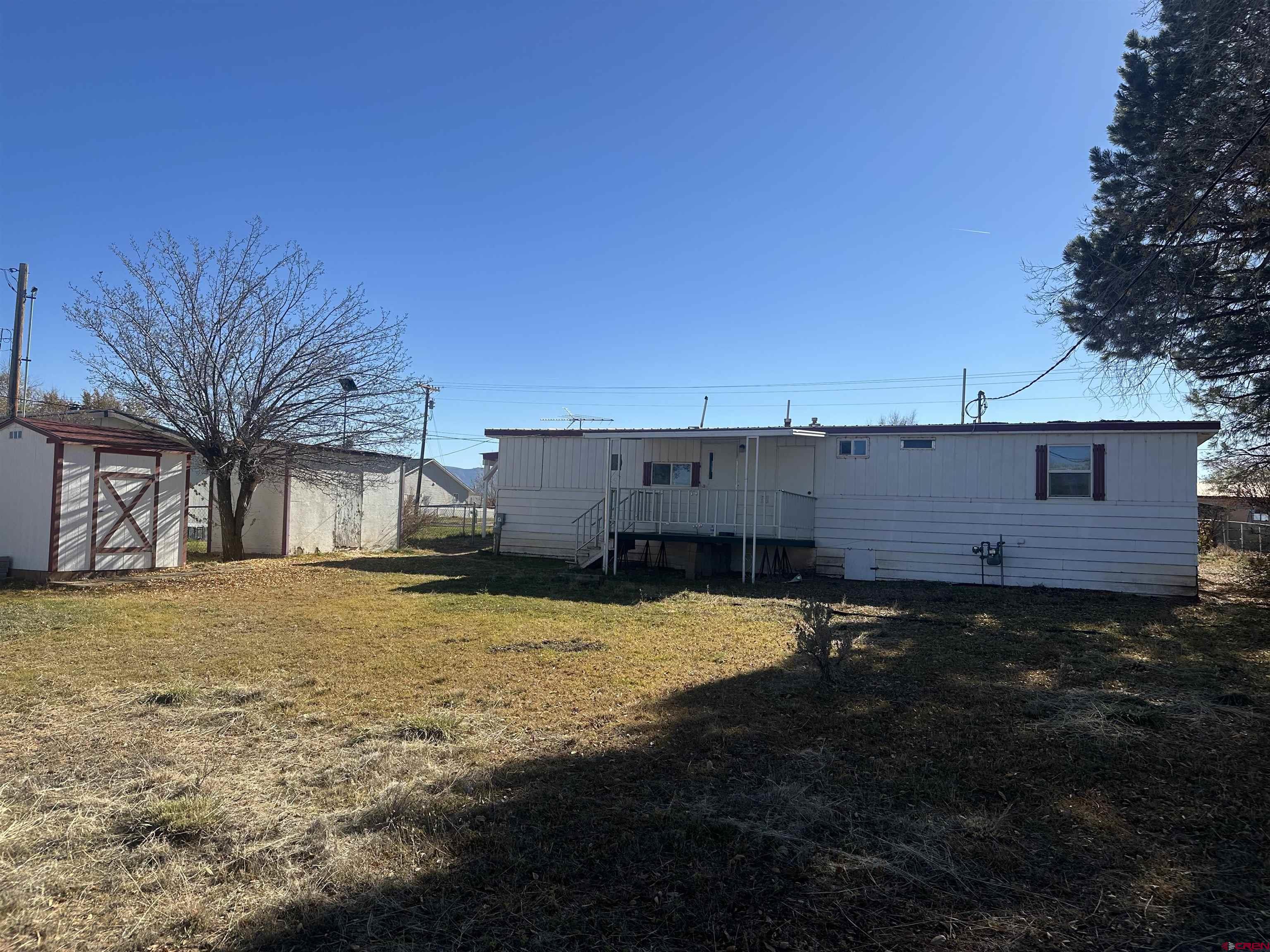 1318 Jackson Street Cortez, CO 81321 - Photo 2 of 13 a backyard of a house