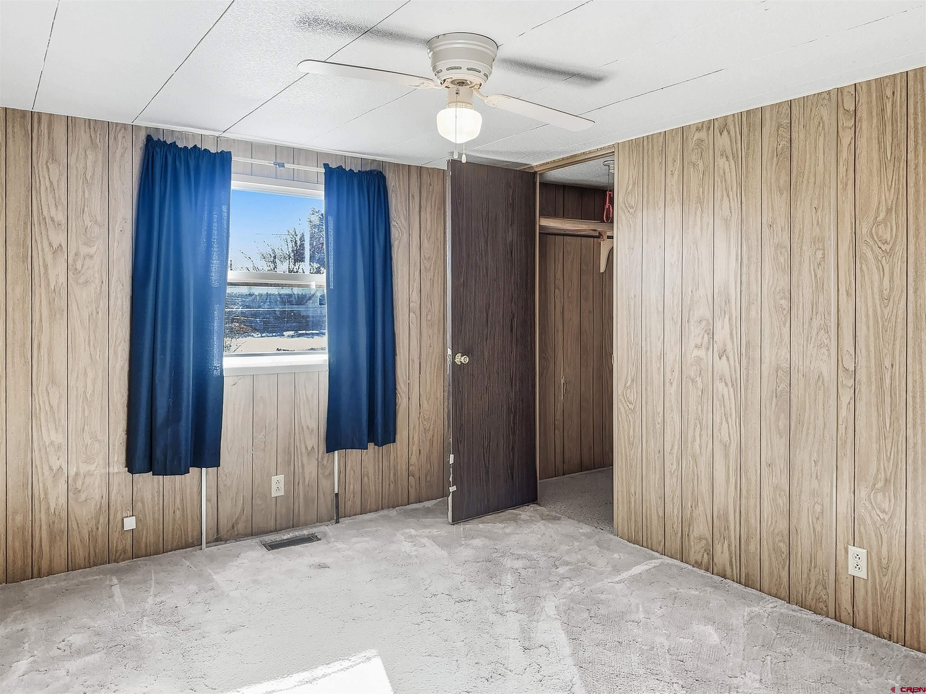 1318 Jackson Street Cortez, CO 81321 - Photo 9 of 13 a view of an empty room with a window