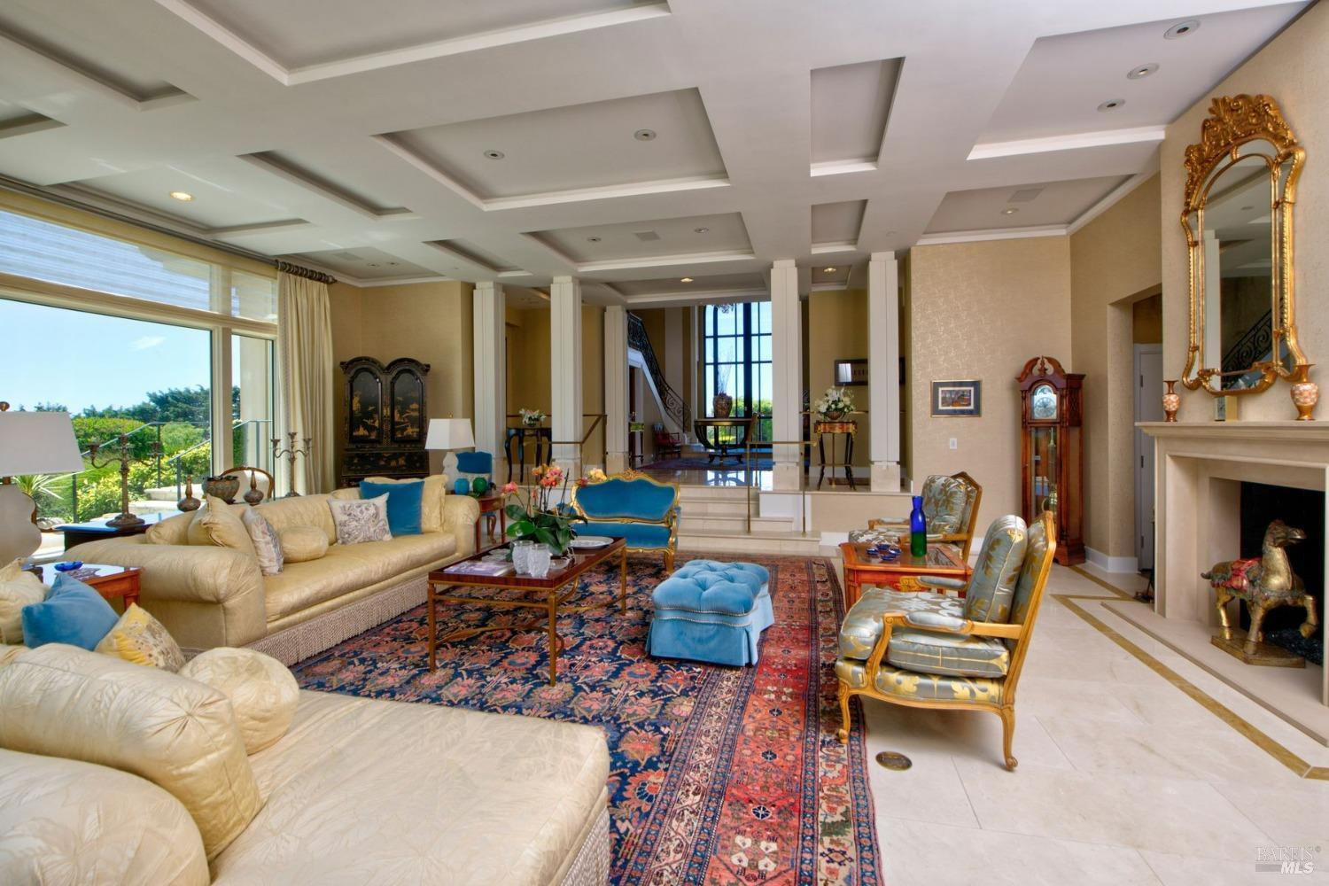 185 Gilmartin Drive Tiburon, CA 94920 - Photo 8 of 32 a living room with furniture fireplace and a large window