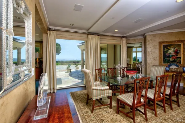 a room with lots of furniture and wooden floor