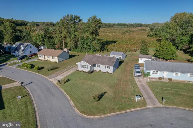 an aerial view of a house with outdoor space
